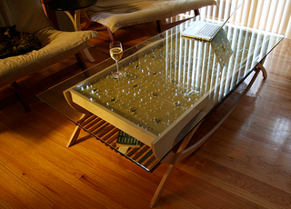 Illustration for article titled The Wave LED Coffee Table Provides Motion-Seeking Light Show